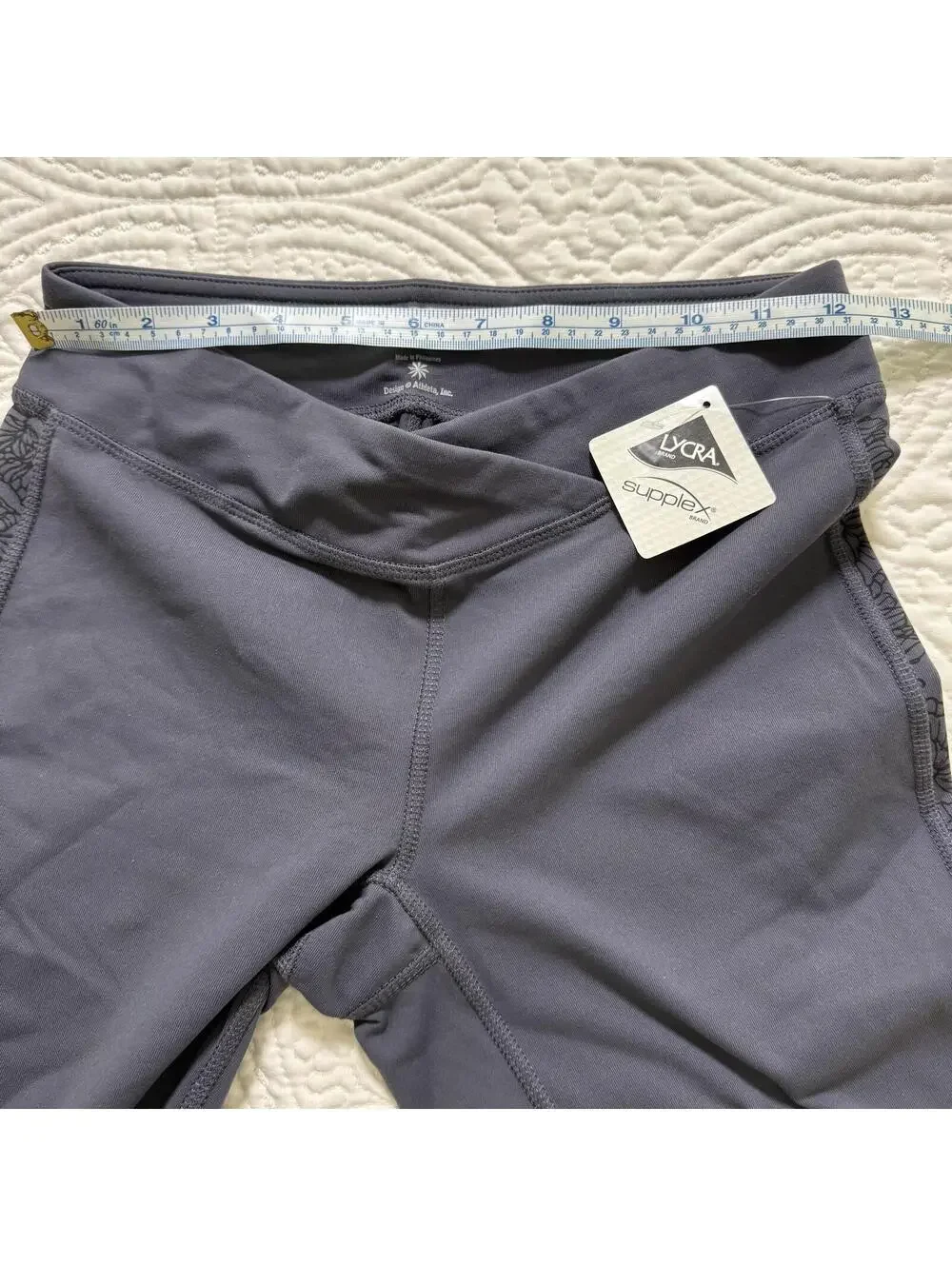 ATHLETA SZ S Elation GRAY Capri Legging Flower motif on Leg Crossover Waist NWT